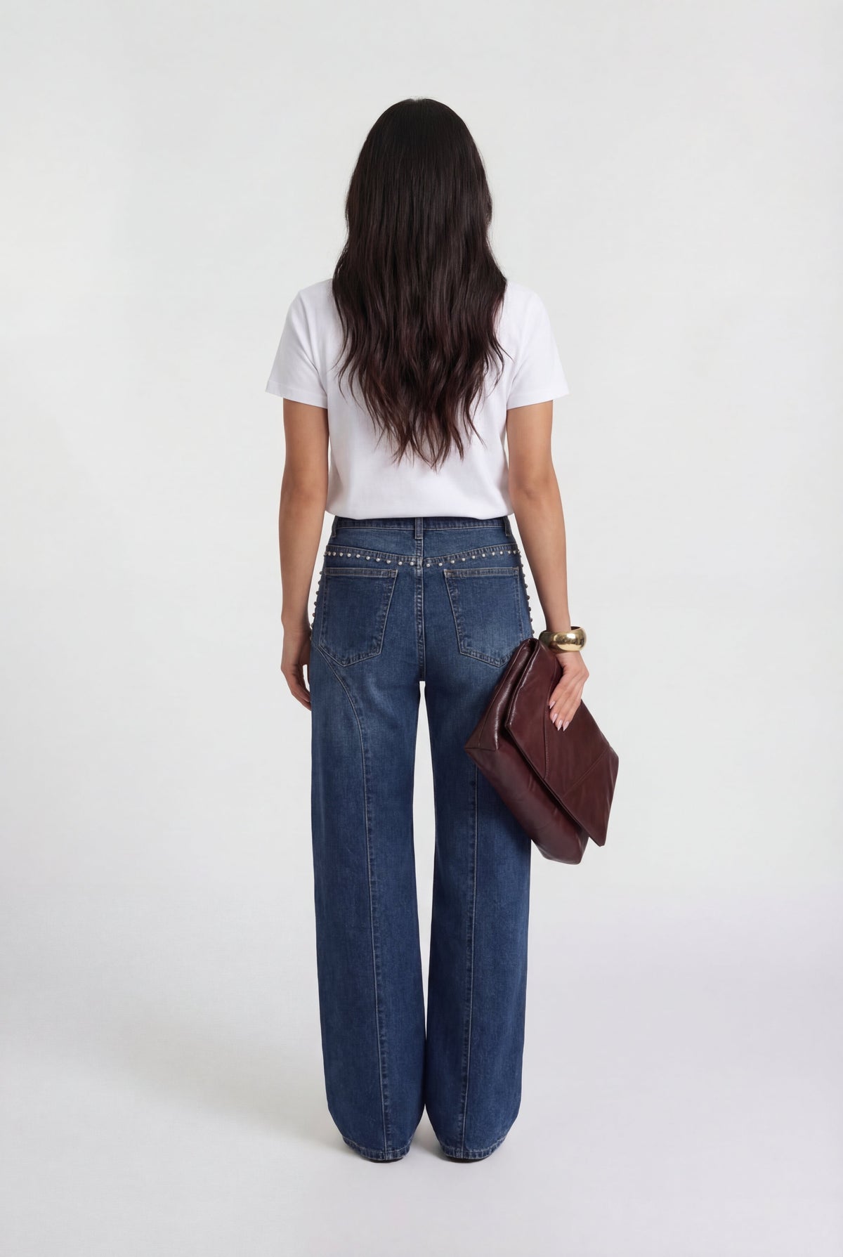 Pantalón vaquero detalles metálicos